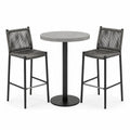 Conjunto de bar con mesa redonda de hormigón y sillas de cuerda sintética